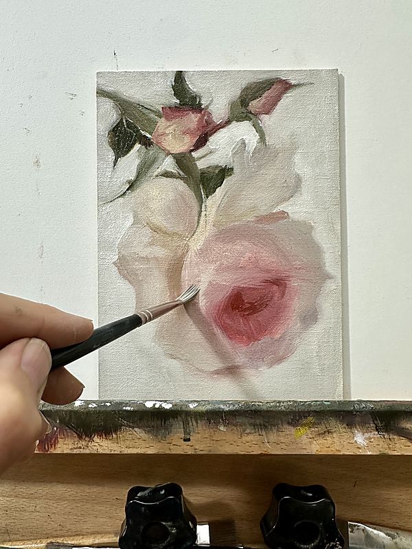 Painting the rose at the easel